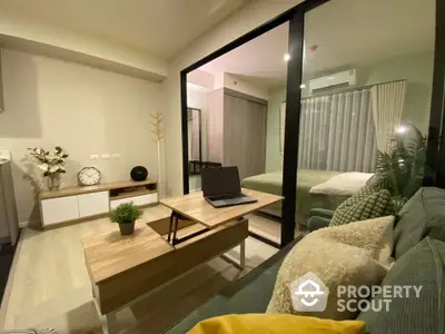 Modern apartment interior with cozy living room and bedroom, stylish decor and natural lighting.