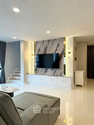 Modern living room with stylish TV wall and elegant decor