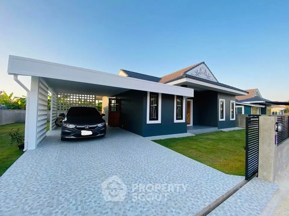 Modern single-story house with carport and manicured lawn