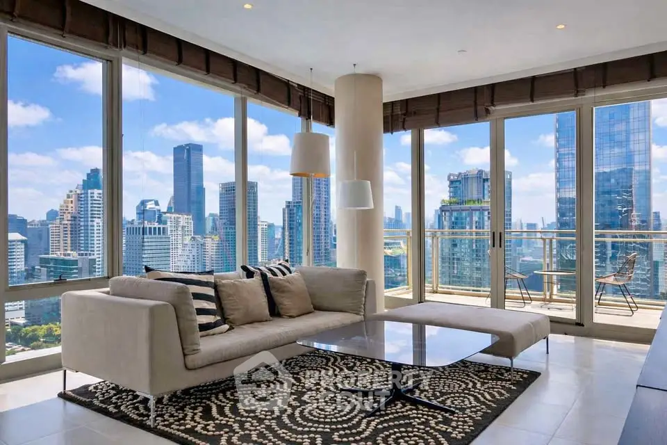 Luxurious corner unit living room with stunning city skyline views and modern furnishings.