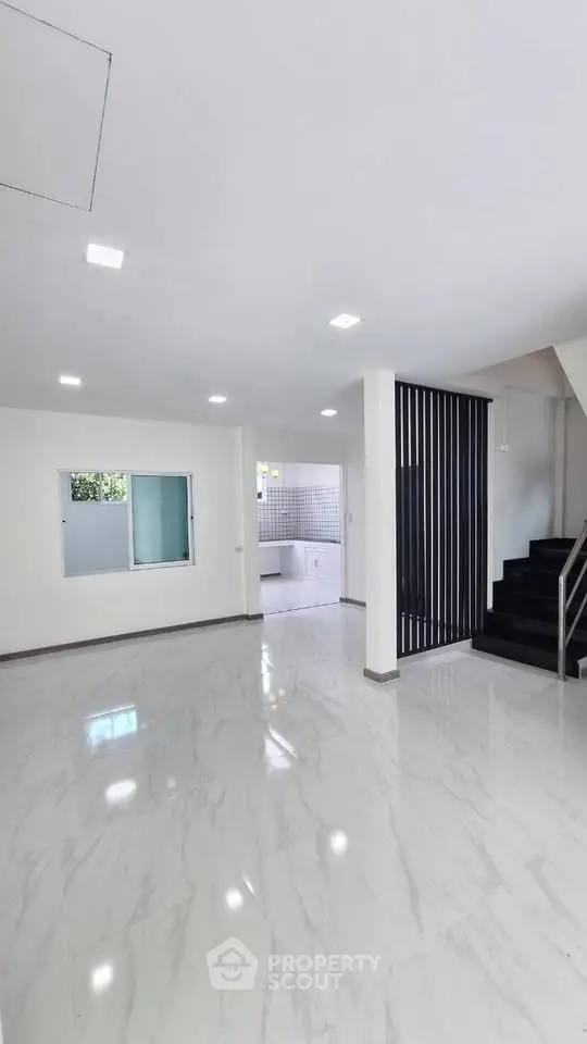Spacious modern living room with sleek marble flooring and open layout