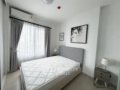 Modern bedroom with stylish decor and natural light