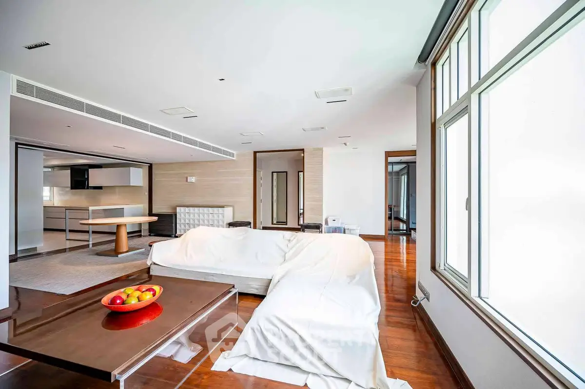 Spacious modern living room with open kitchen and large windows