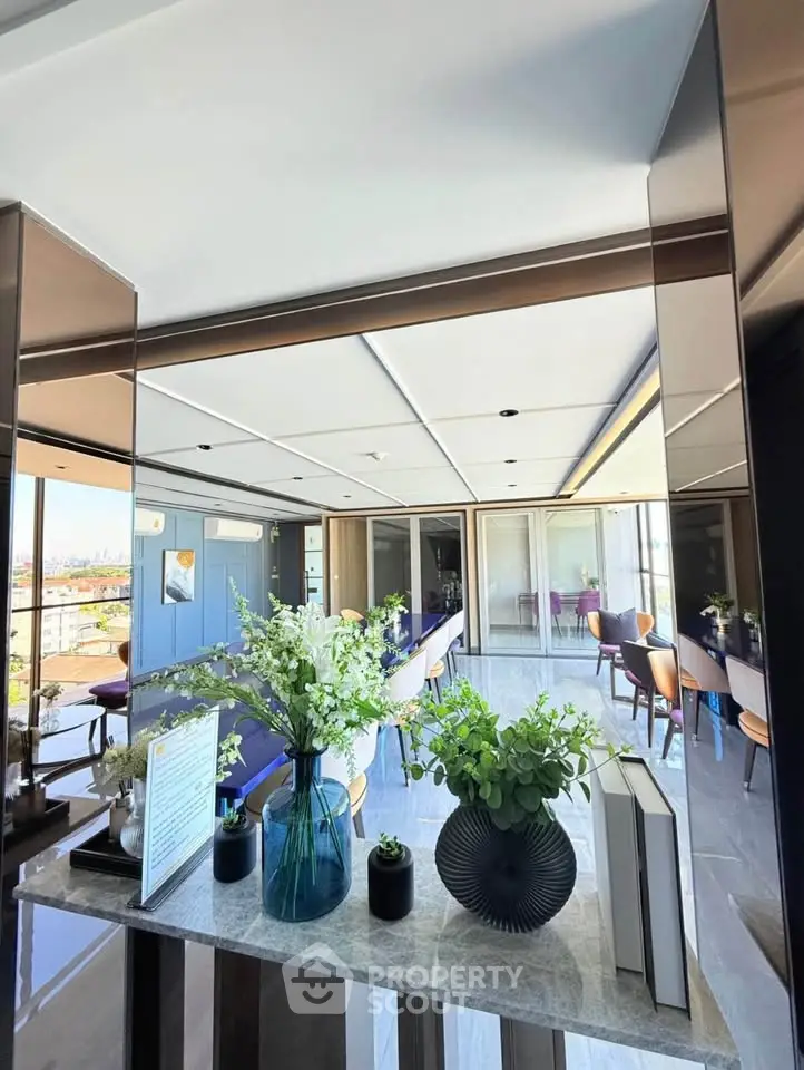 Luxurious modern living room with elegant decor and panoramic city views, perfect for sophisticated urban living.