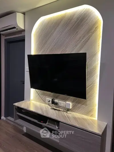 Modern living room with stylish TV wall mount and ambient lighting