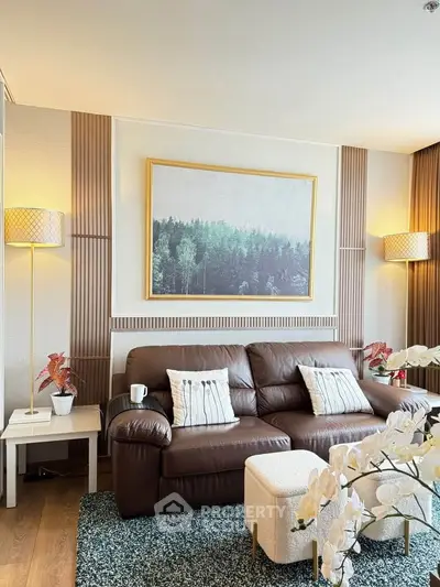 Stylish living room with leather sofa, elegant decor, and cozy lighting