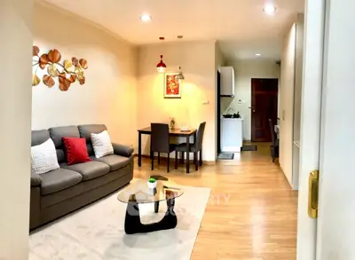 Charming open-layout living room with modern decor and cozy dining area