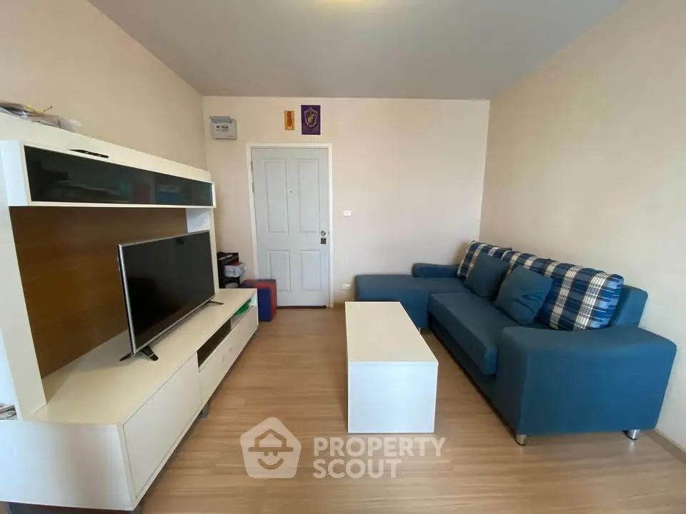 Cozy living room with modern furniture and flat-screen TV