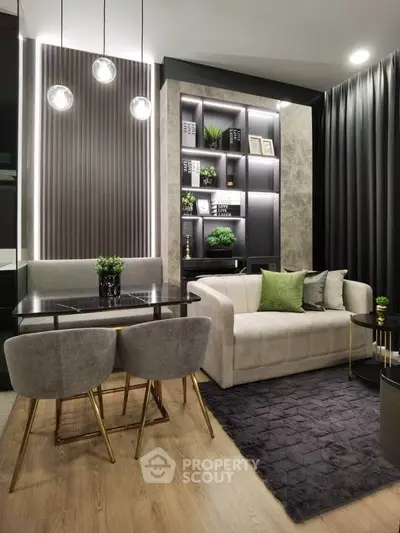 Modern living room with elegant decor, featuring a cozy sofa, stylish dining area, and contemporary lighting.