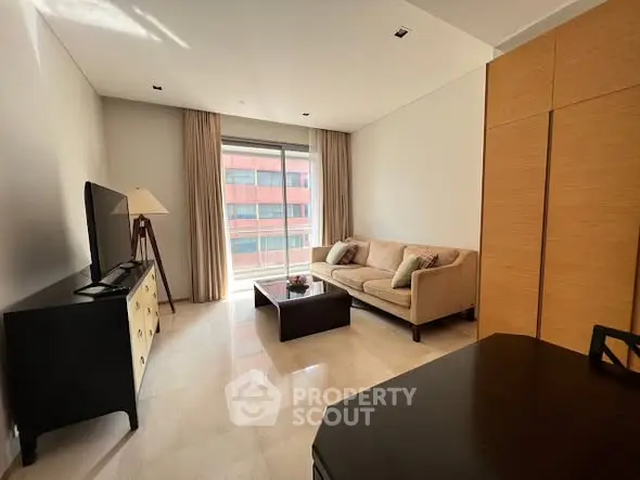 Modern living room with natural light and stylish furniture