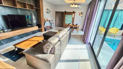 Modern living room with pool view and stylish furniture
