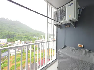 Charming balcony with scenic mountain view, perfect for relaxation and enjoying nature's beauty.