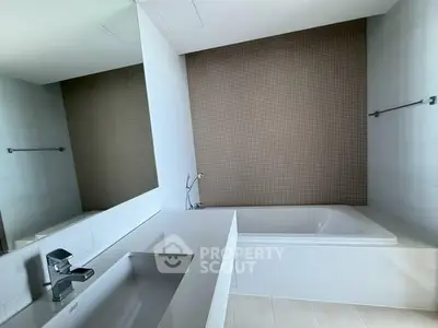 Modern bathroom with sleek design and built-in bathtub