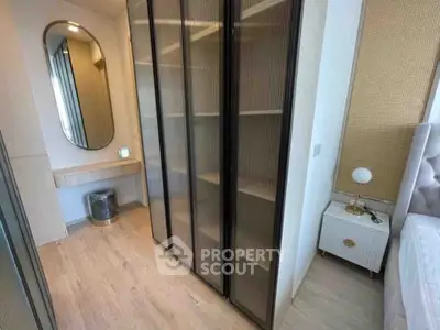 Modern bedroom with sleek wardrobe and elegant decor