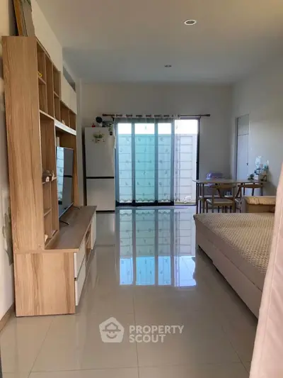 Spacious studio apartment with modern furnishings and natural light