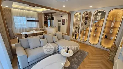 Luxurious living room with modern decor and elegant shelving display