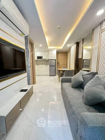 Modern living room with sleek design, open kitchen, and stylish decor