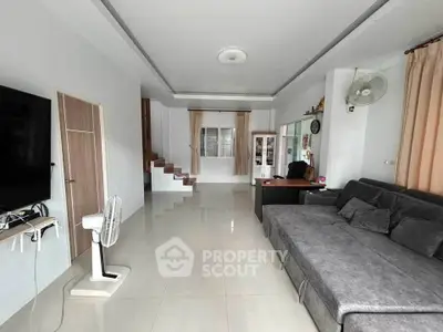 Spacious living room with modern decor and sleek furniture