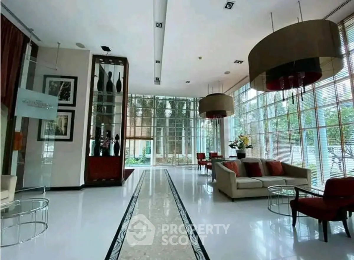 Luxurious modern lobby with elegant decor and floor-to-ceiling windows