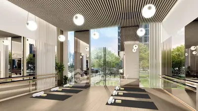 Luxurious yoga studio with floor-to-ceiling windows and serene garden view.