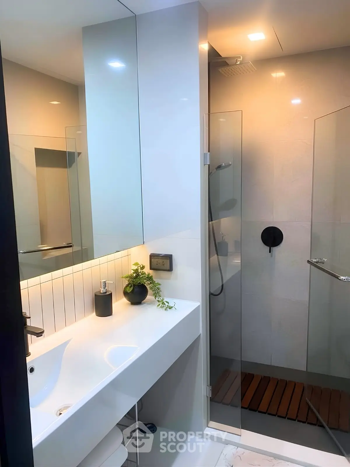 Modern bathroom with sleek design and glass shower enclosure