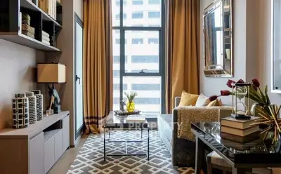 Stylish living room with modern decor and large window view