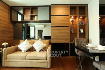 Elegant living room with modern decor and built-in wooden shelves