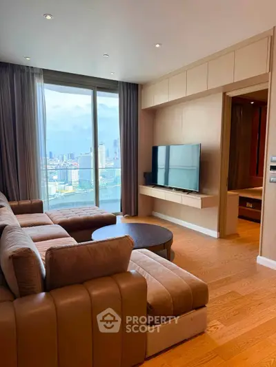 Luxurious living room with stunning city view, featuring modern furniture and floor-to-ceiling windows.