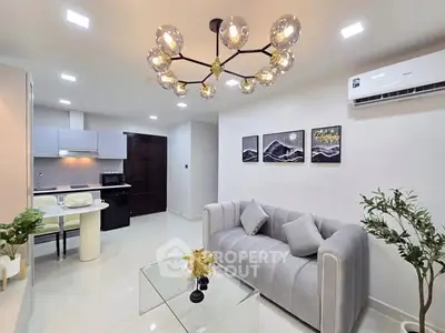 Modern living room with elegant chandelier and stylish decor