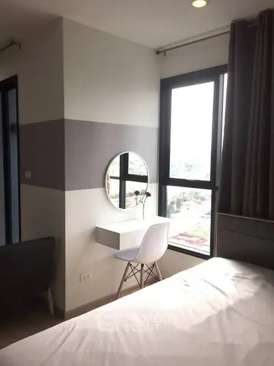 Modern bedroom with stylish vanity and large window view