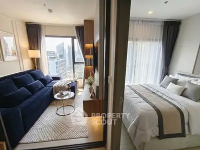 Modern apartment with cozy living room and elegant bedroom, featuring city views and stylish decor.