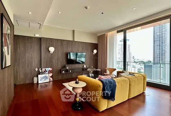 Luxurious living room with modern decor and stunning city view from large windows.