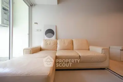 Modern living room with elegant beige sofa and minimalist decor