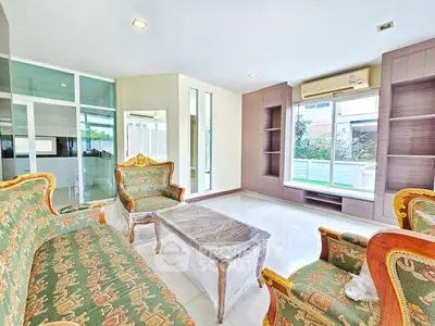 Elegant living room with classic furniture and large windows for natural light