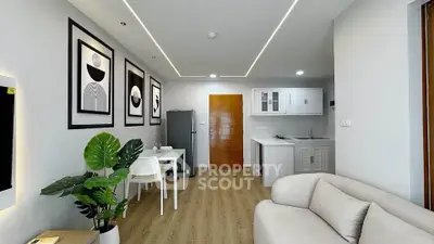 Modern living room with minimalist decor and open kitchen layout