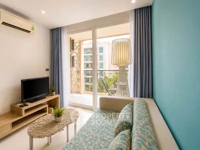Modern living room with stylish decor and balcony view in a contemporary apartment.