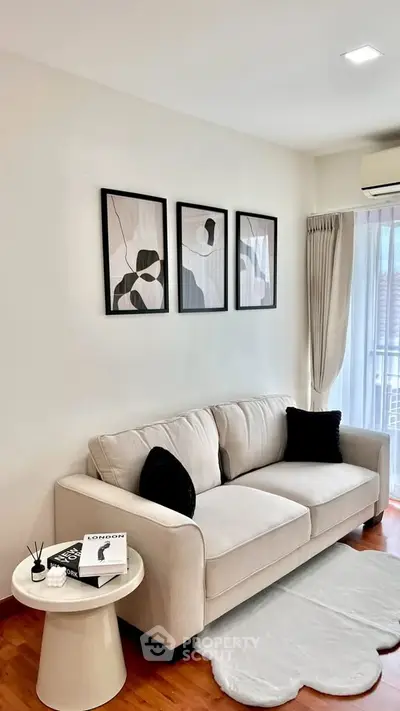 Stylish living room with modern decor and cozy sofa in a bright apartment.