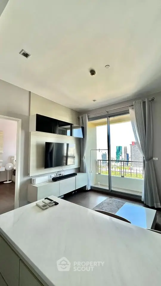 Modern living room with balcony and city view in high-rise apartment