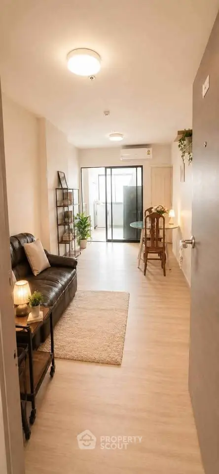Charming living room with cozy seating and natural light, perfect for relaxation and entertaining.