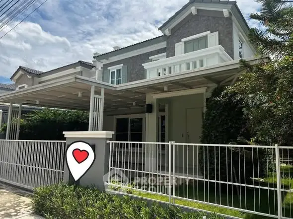 Charming two-story house with spacious front yard and modern design.