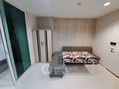 Modern living room with stylish furniture and wooden accent wall