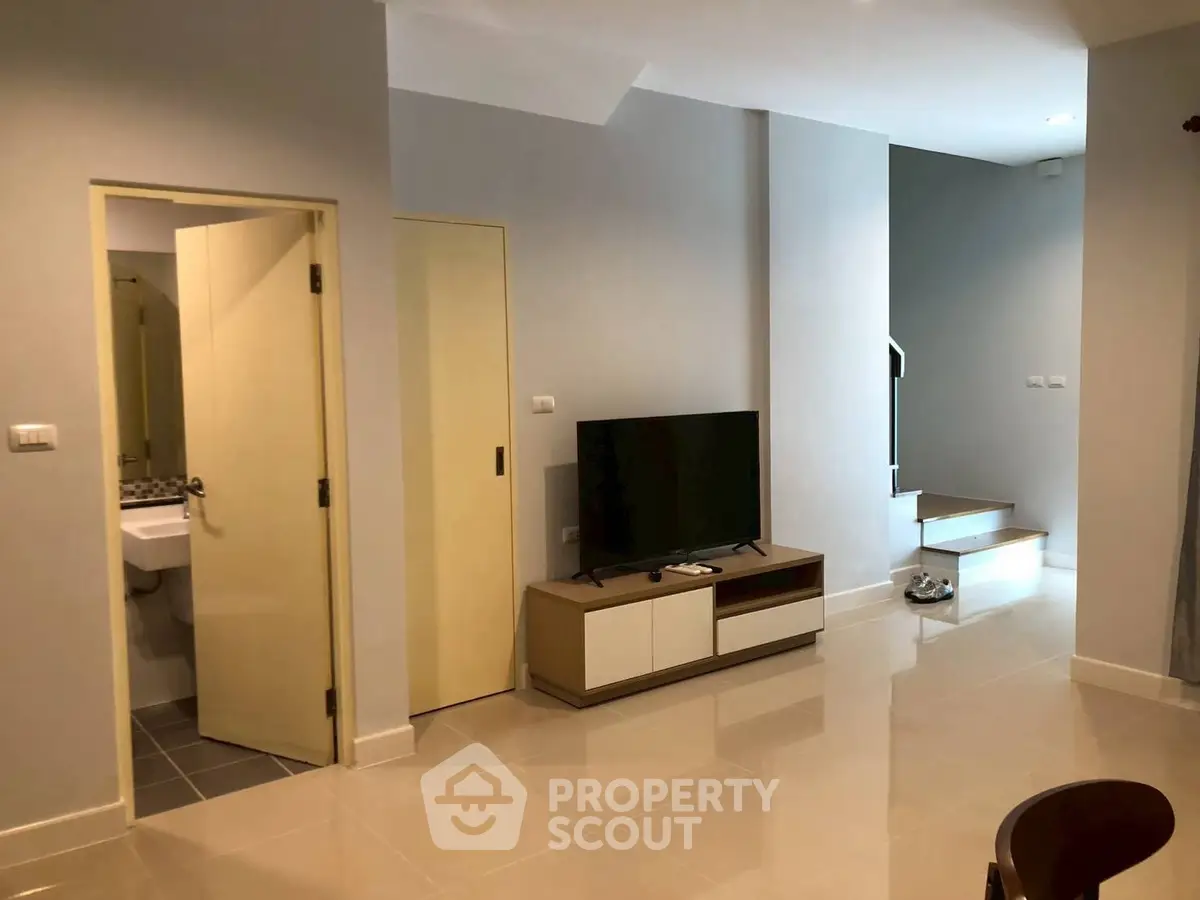Modern living room with sleek TV unit and open space design