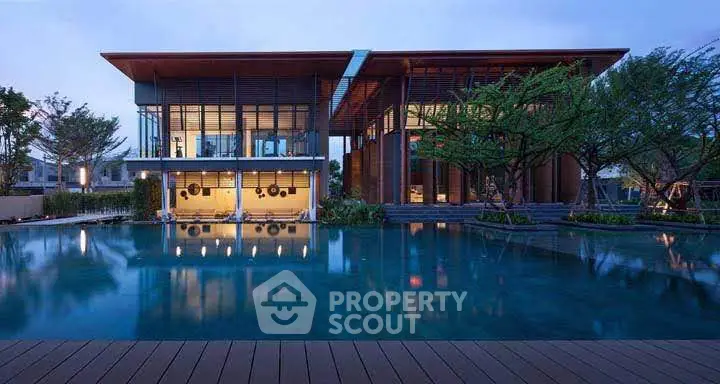 Luxurious modern building with stunning pool and serene garden view