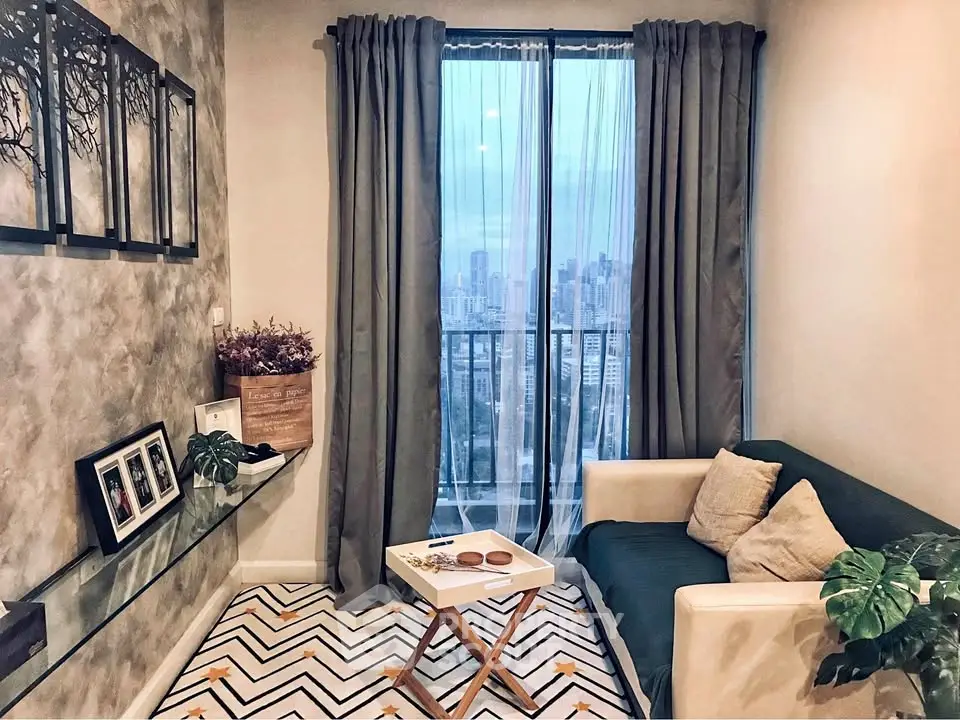 Chic living room with city view, cozy sofa, and stylish decor