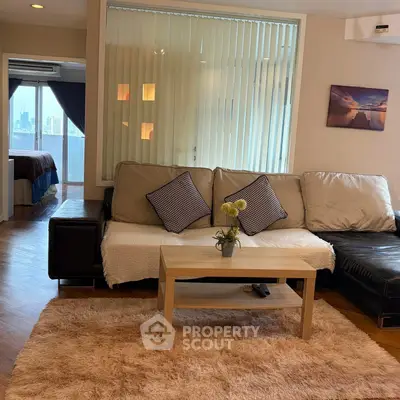 Spacious living room with cozy sofa and city view in modern apartment