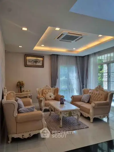 Elegant living room with classic furniture and large windows