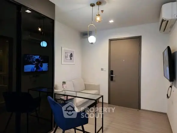 Modern living room with stylish decor and sleek furniture in a contemporary apartment.