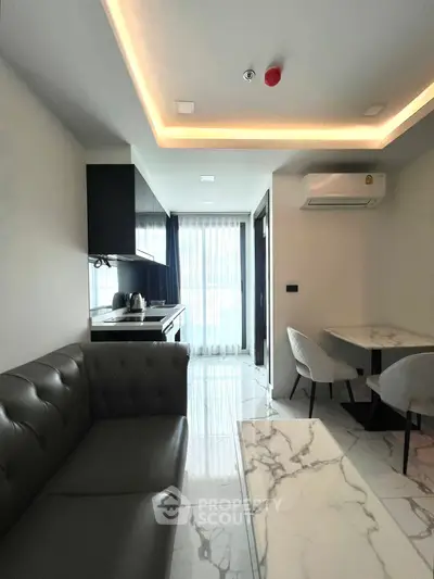 Modern living room with sleek kitchen and elegant marble flooring