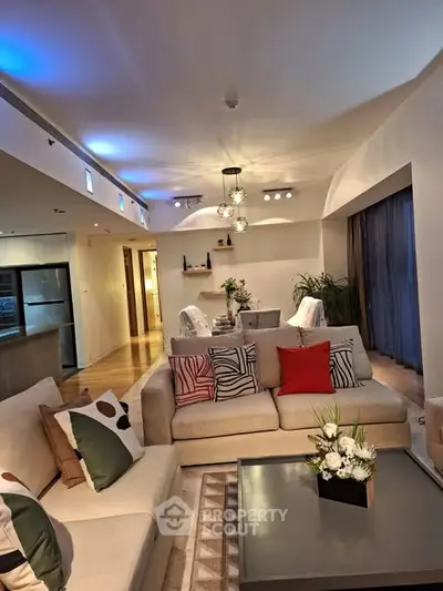 Luxurious modern living room with elegant decor and ambient lighting