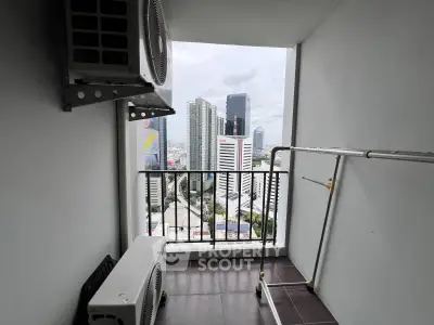 High-rise balcony with cityscape view and air conditioning units, perfect for urban living.